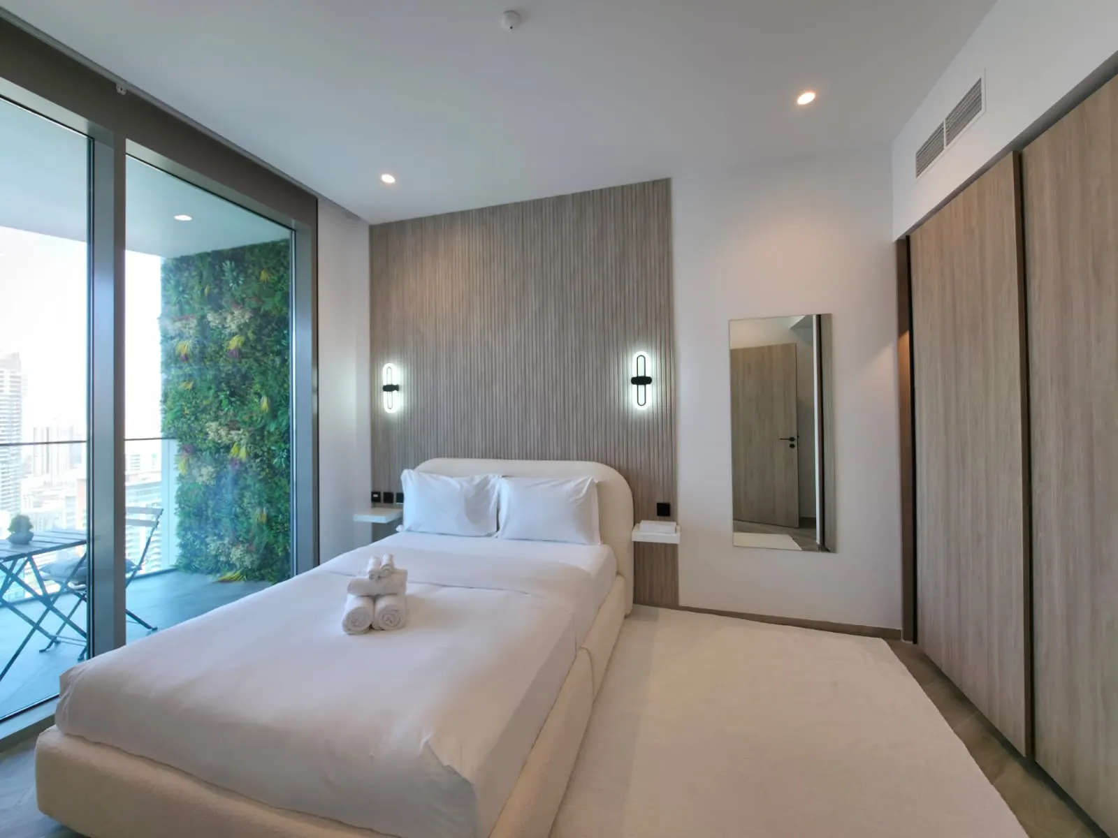 Bedroom with a green plant wall